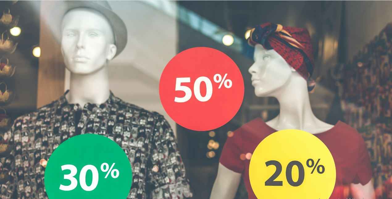 two dummies standing and showing 50% and 20% sale